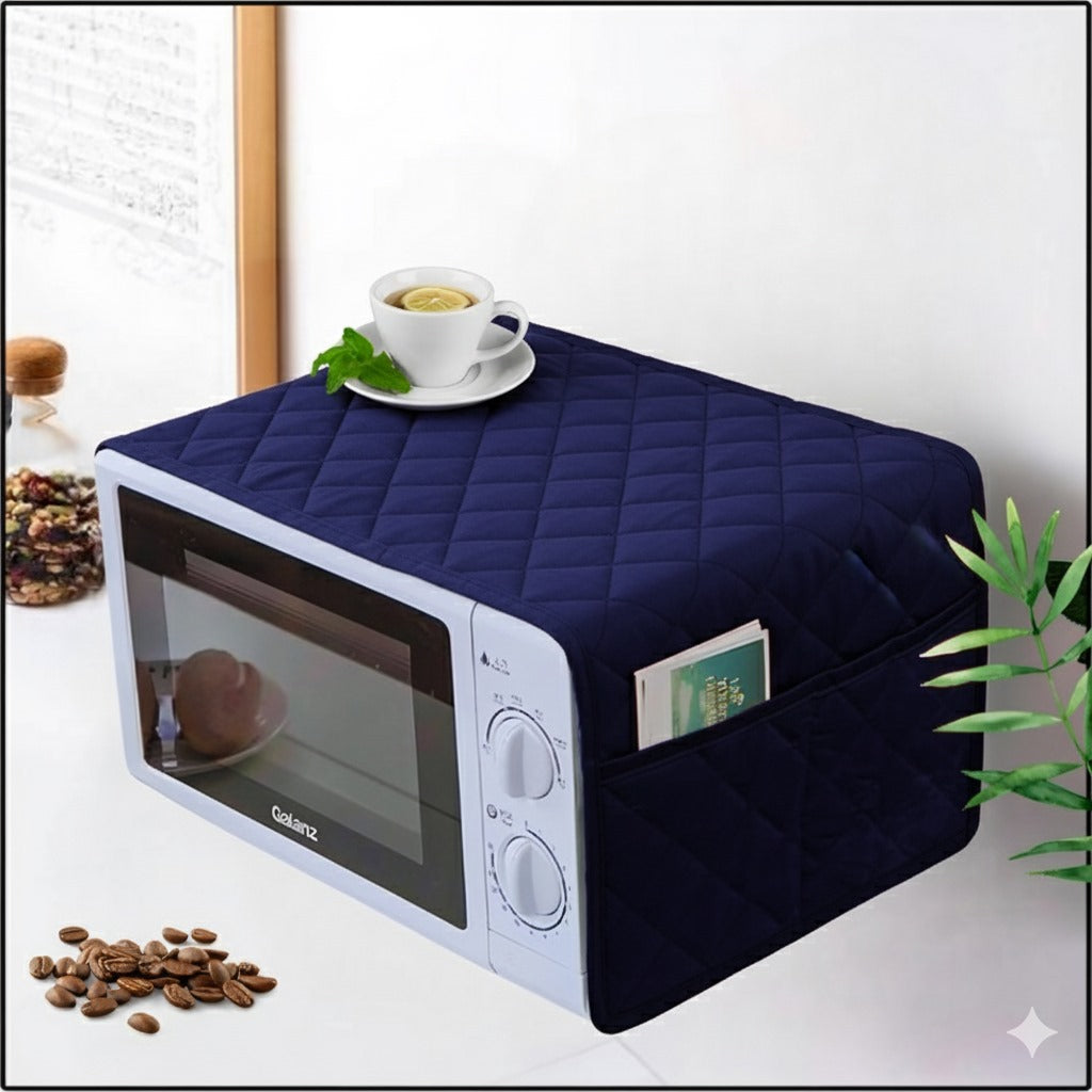 Navy quilted microwave cover with a cup of tea on a white surface.