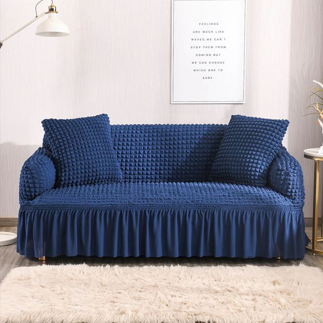 Blue textured sofa cover on a sofa in a living room setting.