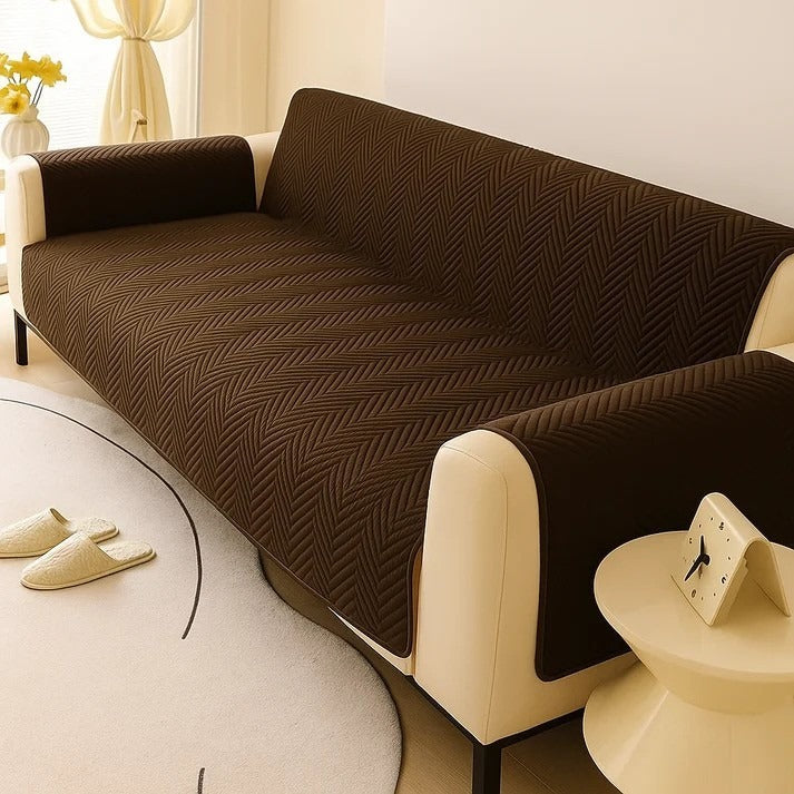 Brown textured sofa cover on a beige sofa in a living room setting.
