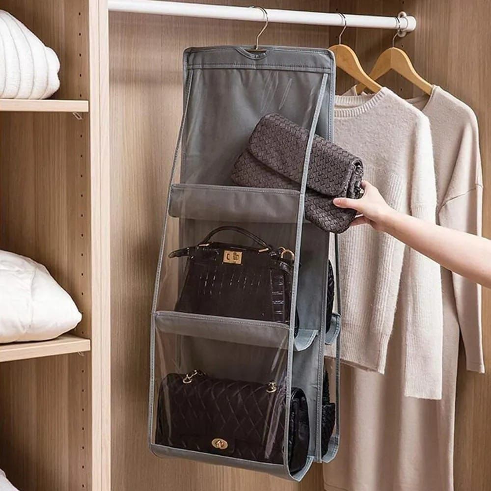 Hanging organizer with purses in a closet setting