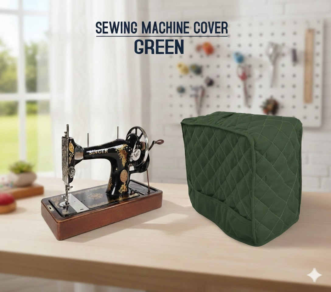 Green sewing machine cover on a table with a vintage sewing machine.