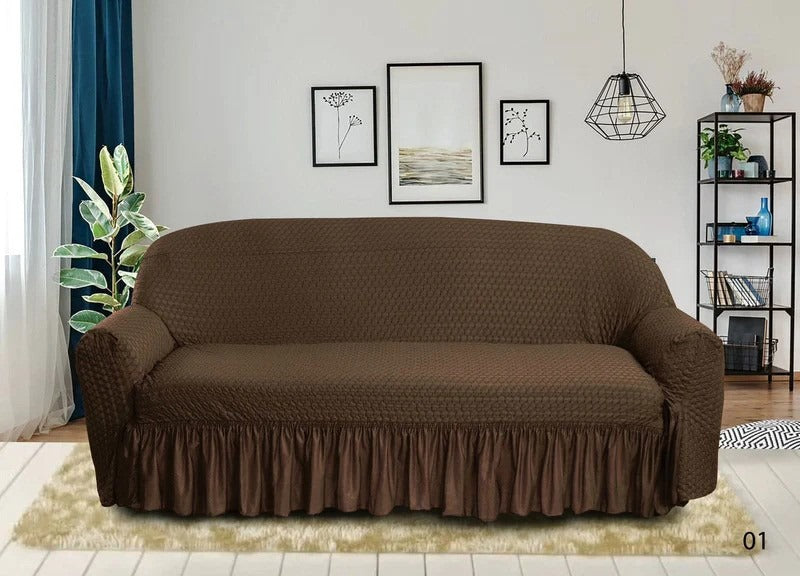 Brown sofa cover on a couch in a living room setting with decor elements.