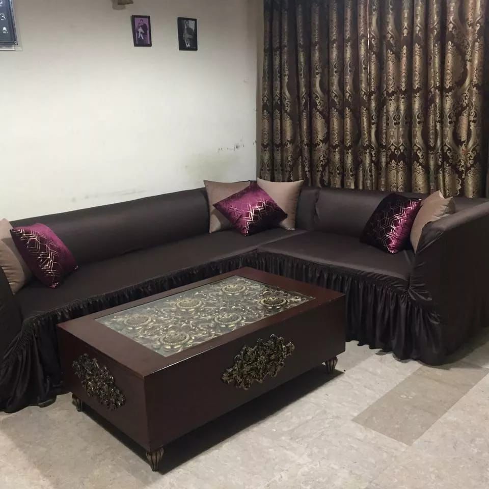 Living room with a dark brown sectional sofa and matching coffee table.