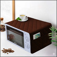 Premium quilted oven cover with multi-purpose pockets on microwave